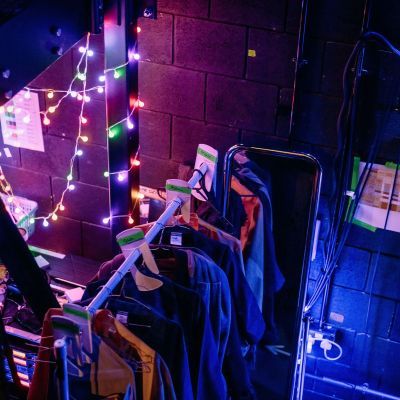 Costume rail backstage on the set of Urinetown